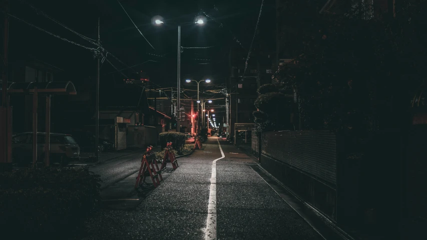 a street filled with street lights and cars