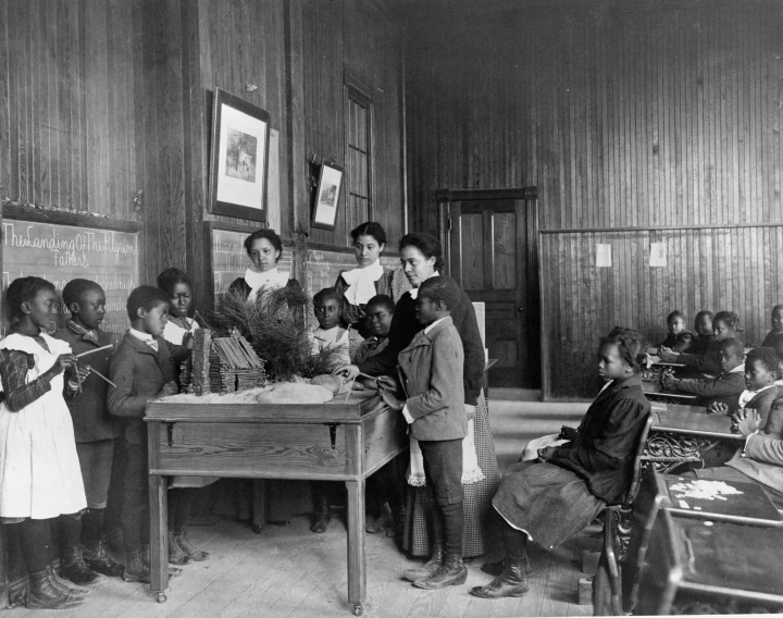black and white po of children in a school classroom