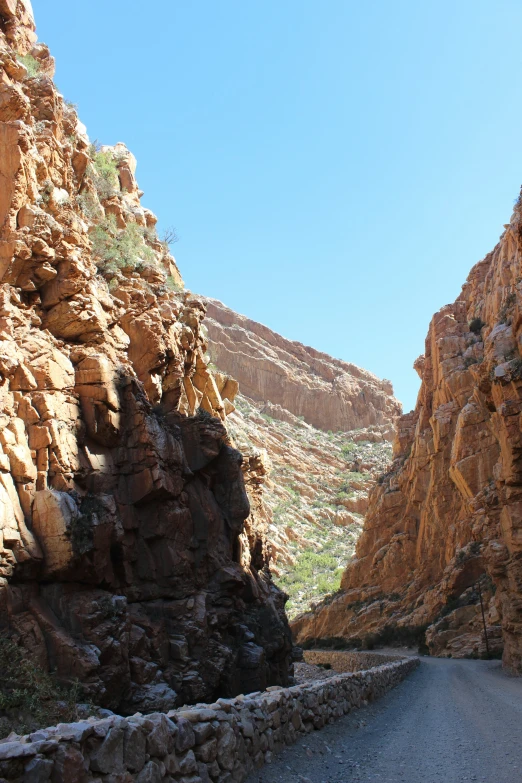 this is a winding canyon with many red hills