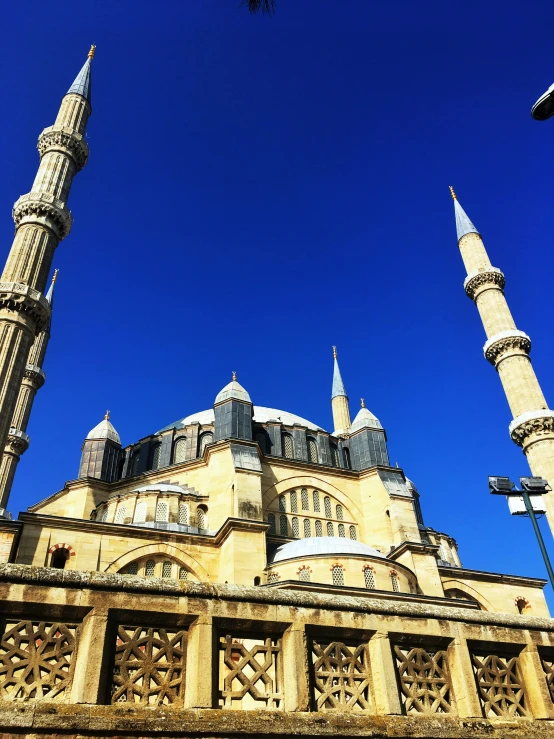 a tall building with some very pretty towers