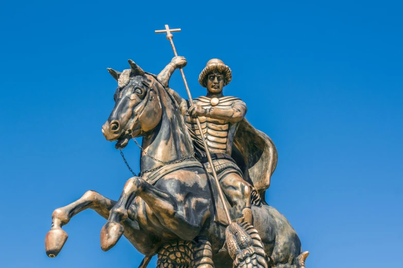 there is a statue of a man riding a horse