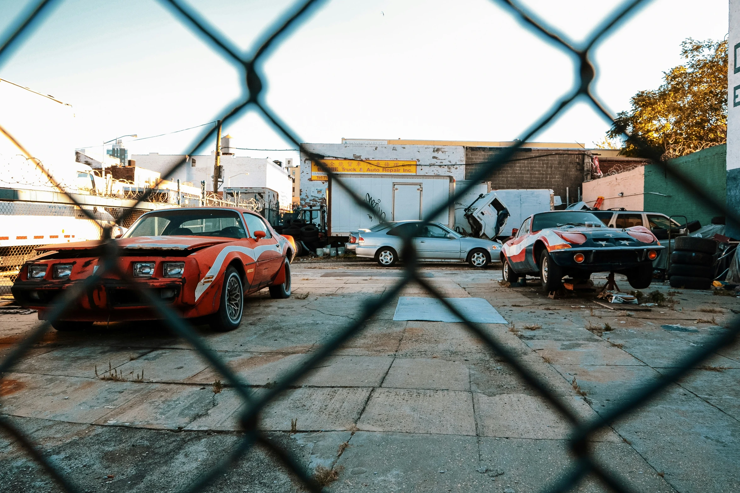 some cars that are parked in a parking lot