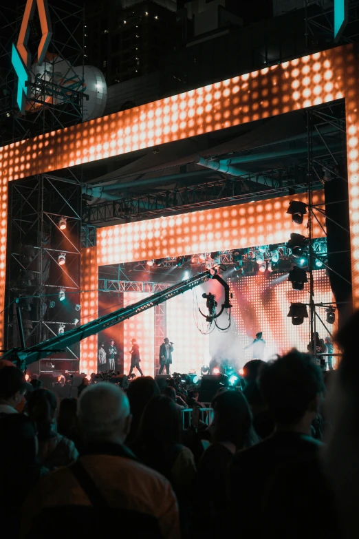 an aerial stunt on stage while spectators watch