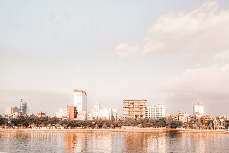 the skyline is seen in this pograph looking across the water