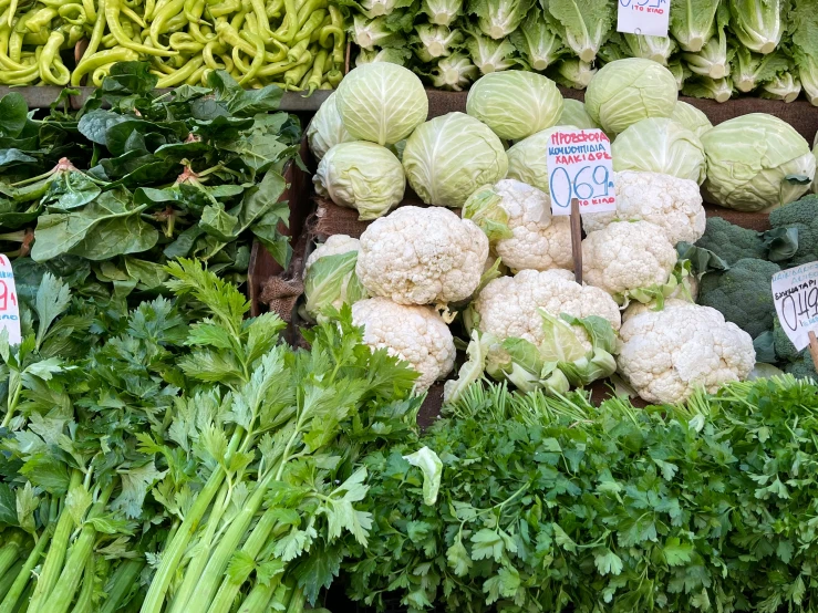 there is a large display of vegetables in the shop