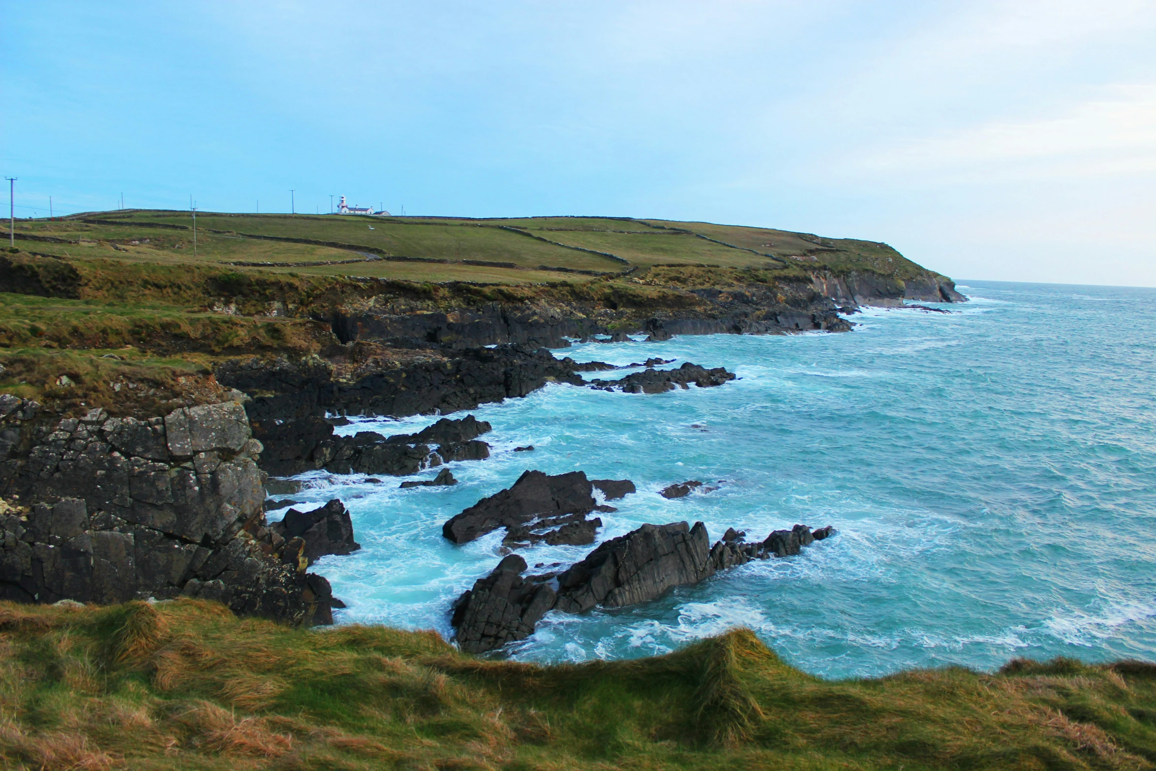 a large body of water surrounded by rocky hills