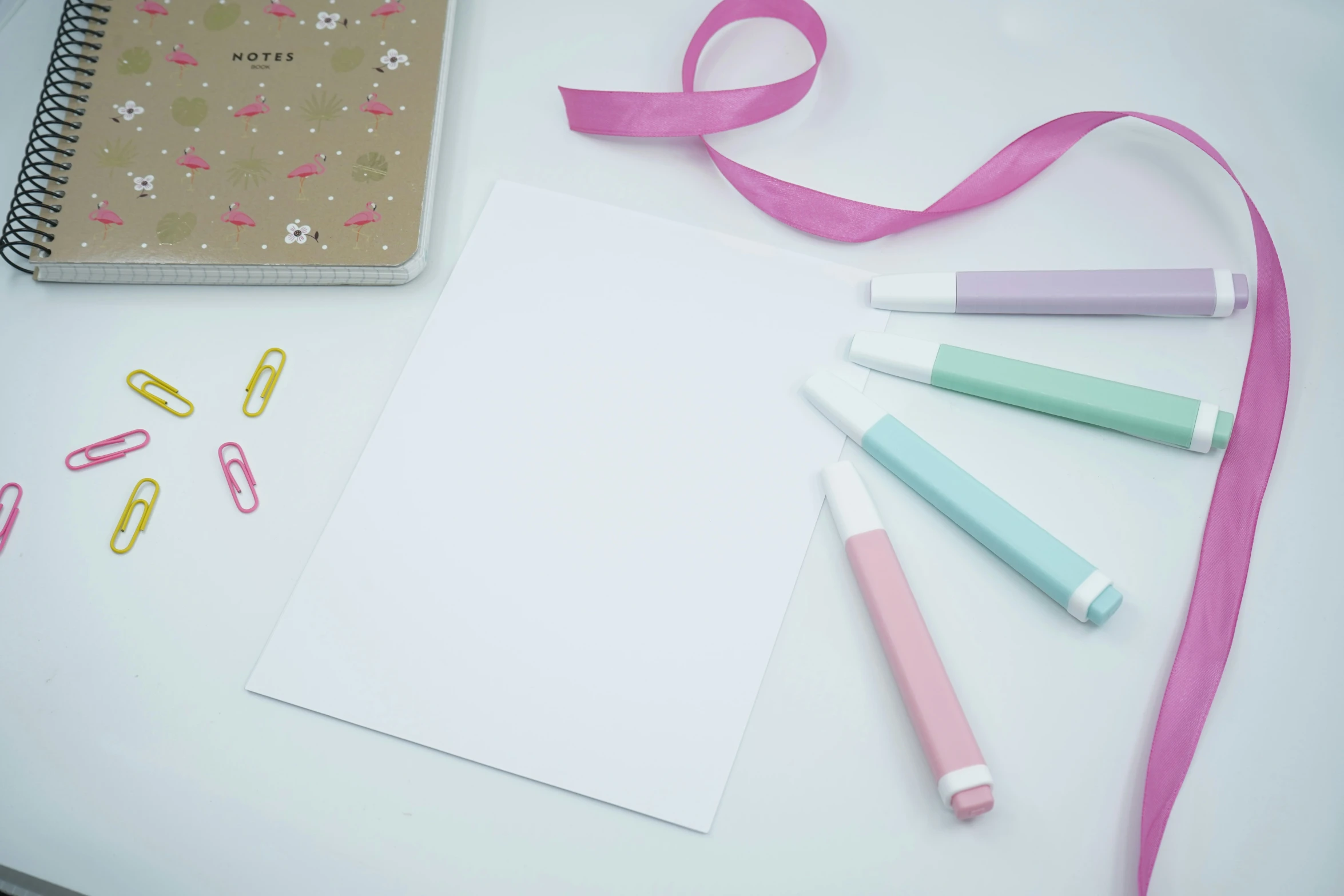 there are some school supplies laying out on a desk