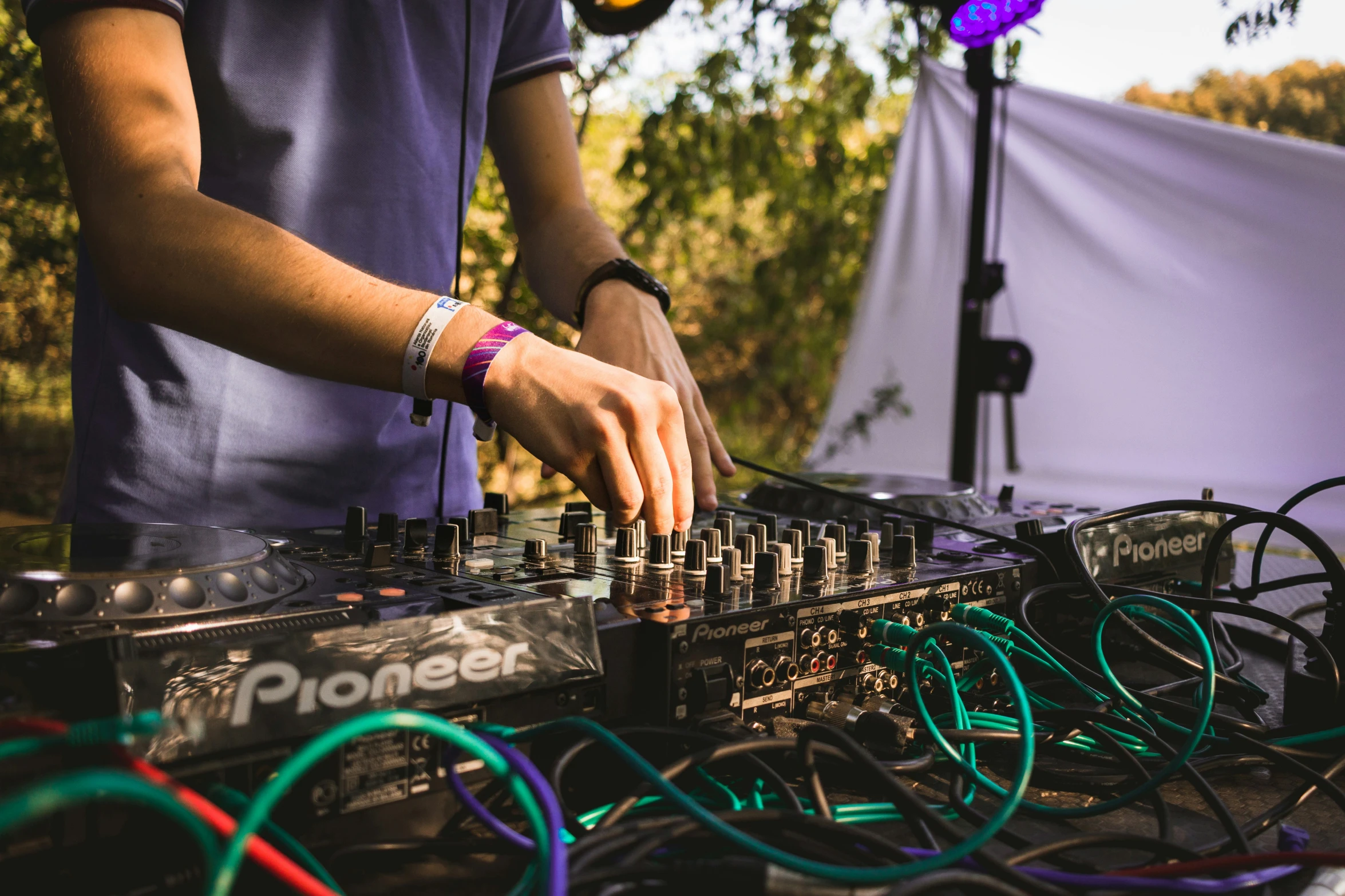 a man using his electronic device at an outdoor music event