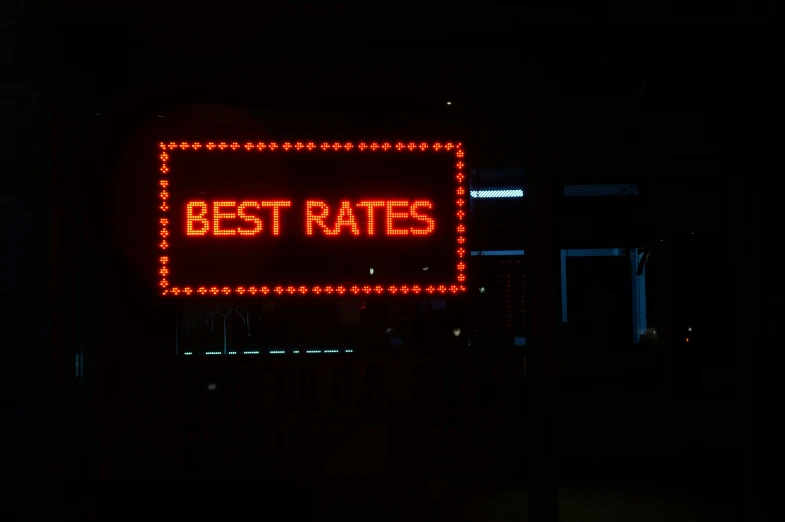 a sign with the words best rate hanging off of it