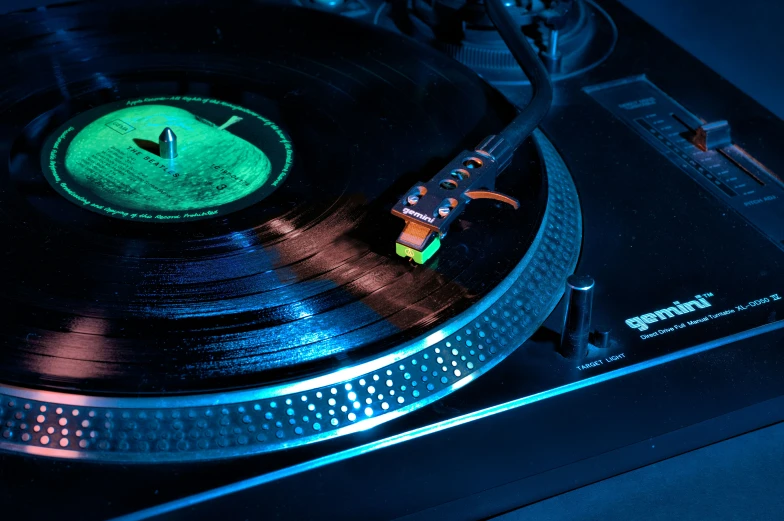 a turntable has a glowing led underneath it