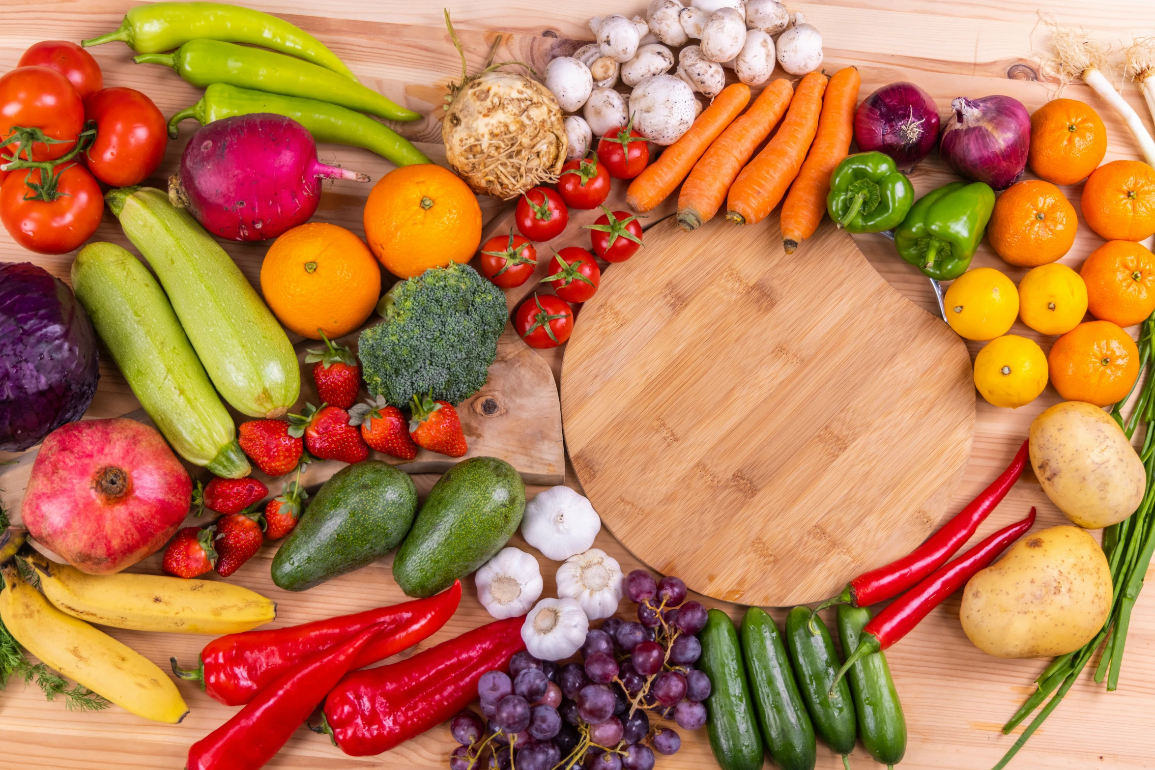 fruits and vegetables all arranged in a circle on a table