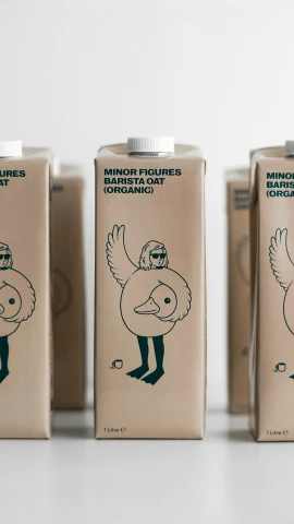three packages of drinks with drawings of animals on them