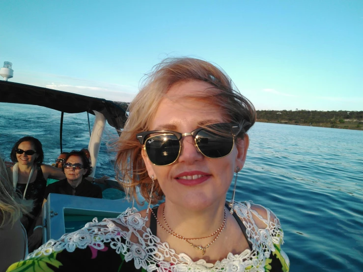 a close up of a woman wearing sunglasses