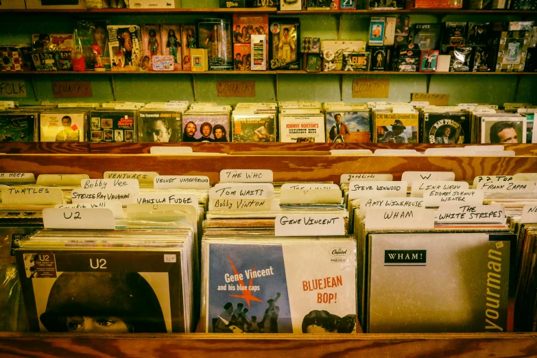 records in a record store with their sales signs