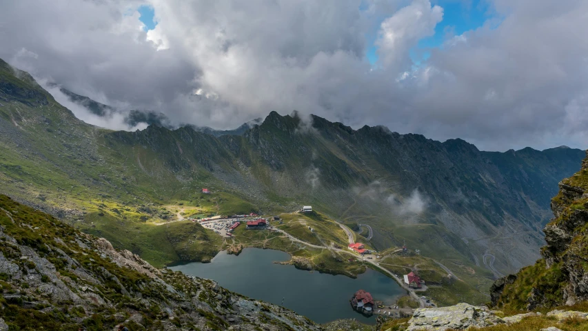 an overview view of a lake surrounded by mountains