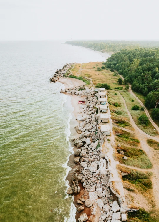 an overhead view of a lake and the beach