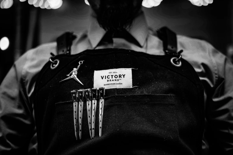 back view of a person with a bag for victory logo on it