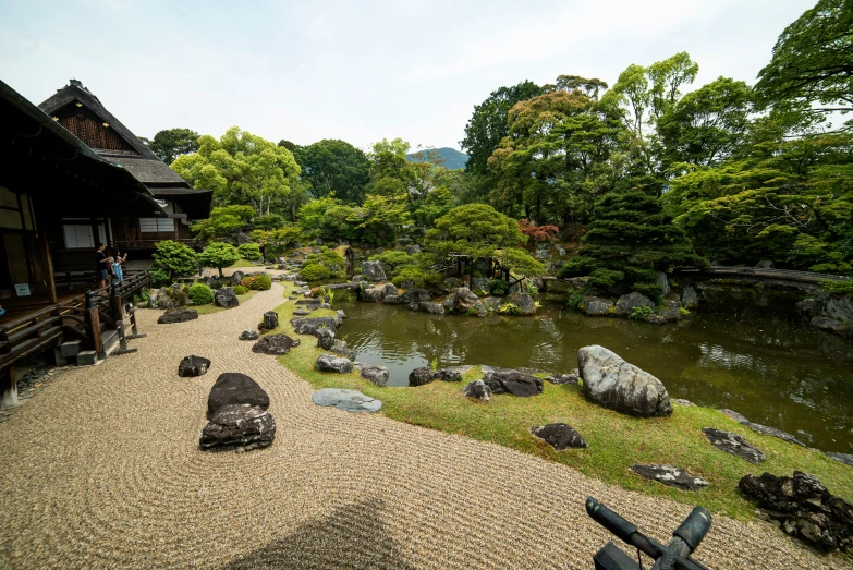 a large rock and gravel path leading to a river