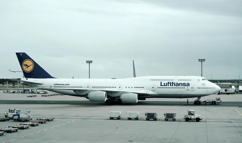 a white airplane is sitting on the tarmac