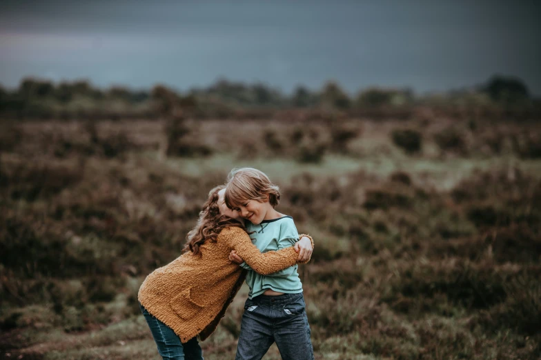 two children playing in an open field