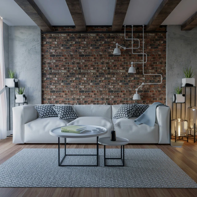 a brick wall in a room with a white couch