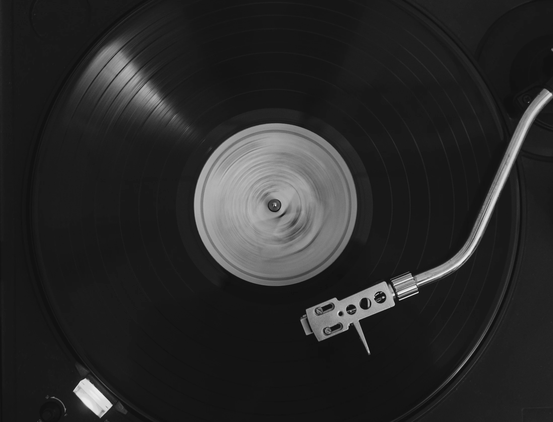 a turntable on top of a record player with an electric tape