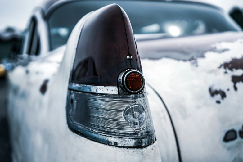 the taillights of a parked car in snow