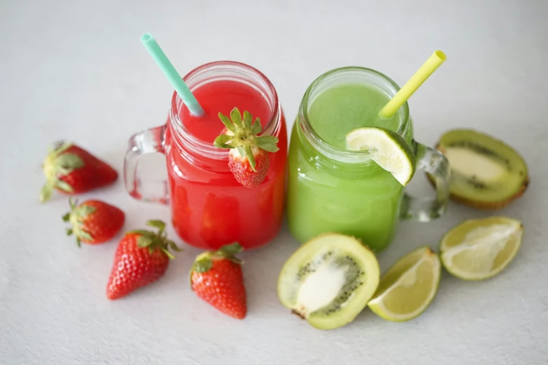 fruits are sitting next to a drink that is on the table