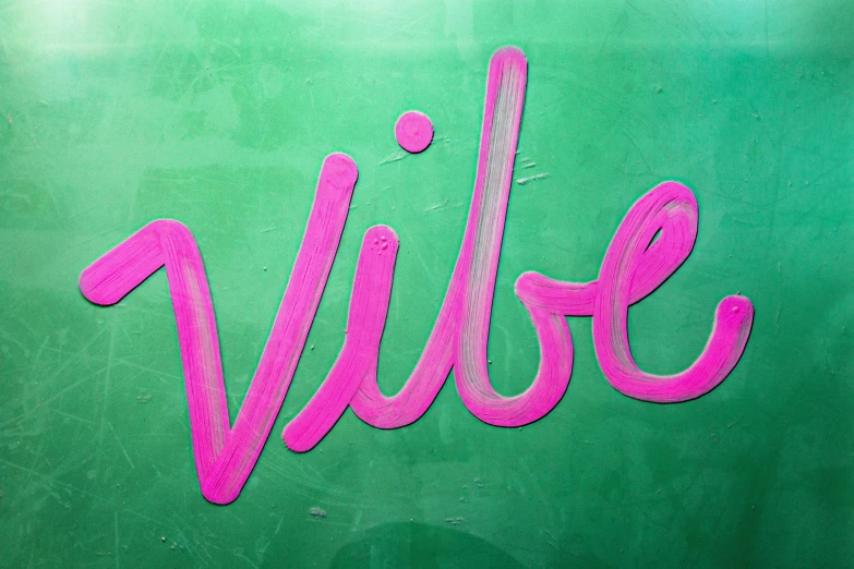 the name vivre painted on to of a green wall