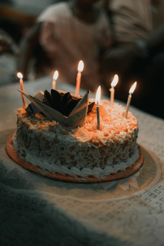 a cake that has candles in it on a table