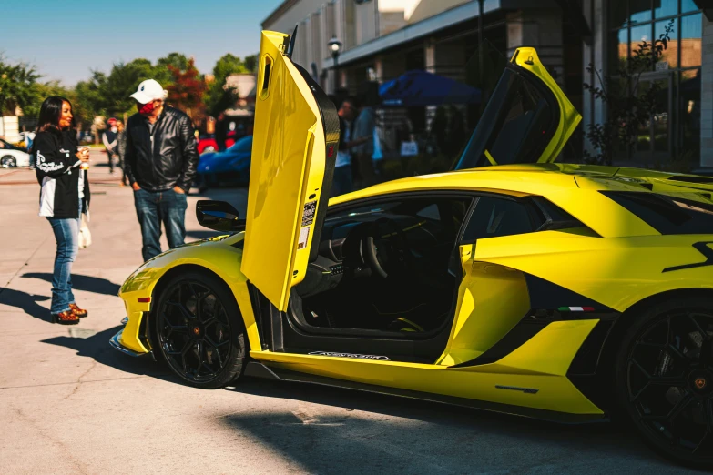 a yellow car with its open door opened