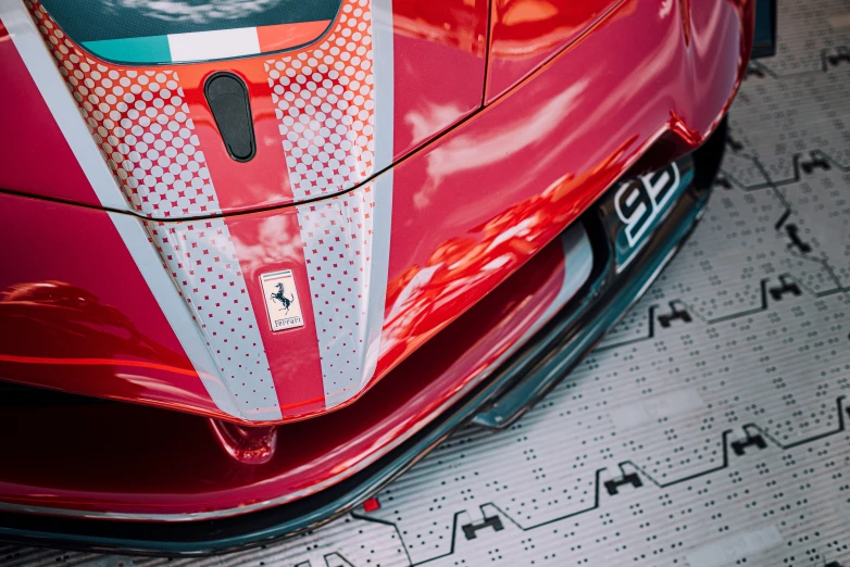 a close up view of the front of a red sports car