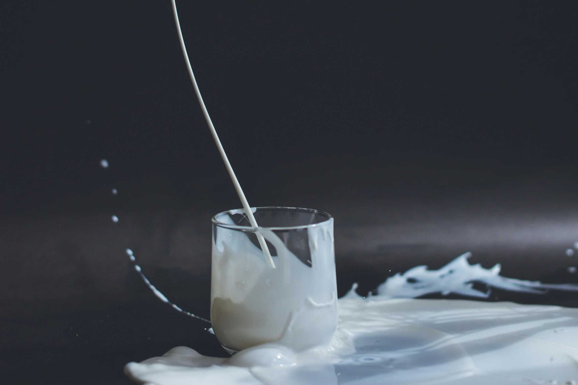 an image of milk pouring in to a glass