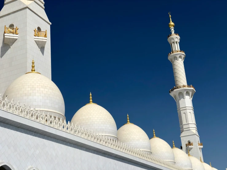 an ornate building has white and gold details