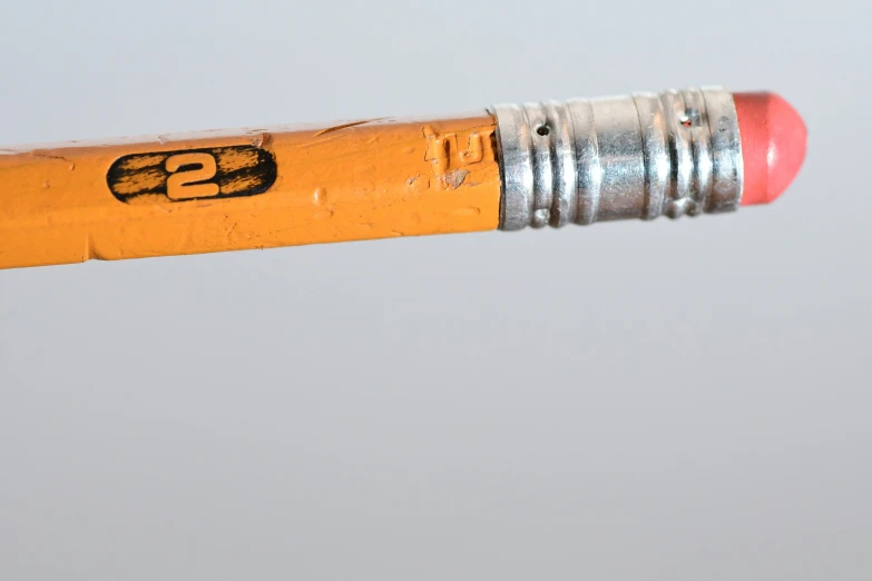 close up view of a pencil with a bullet point