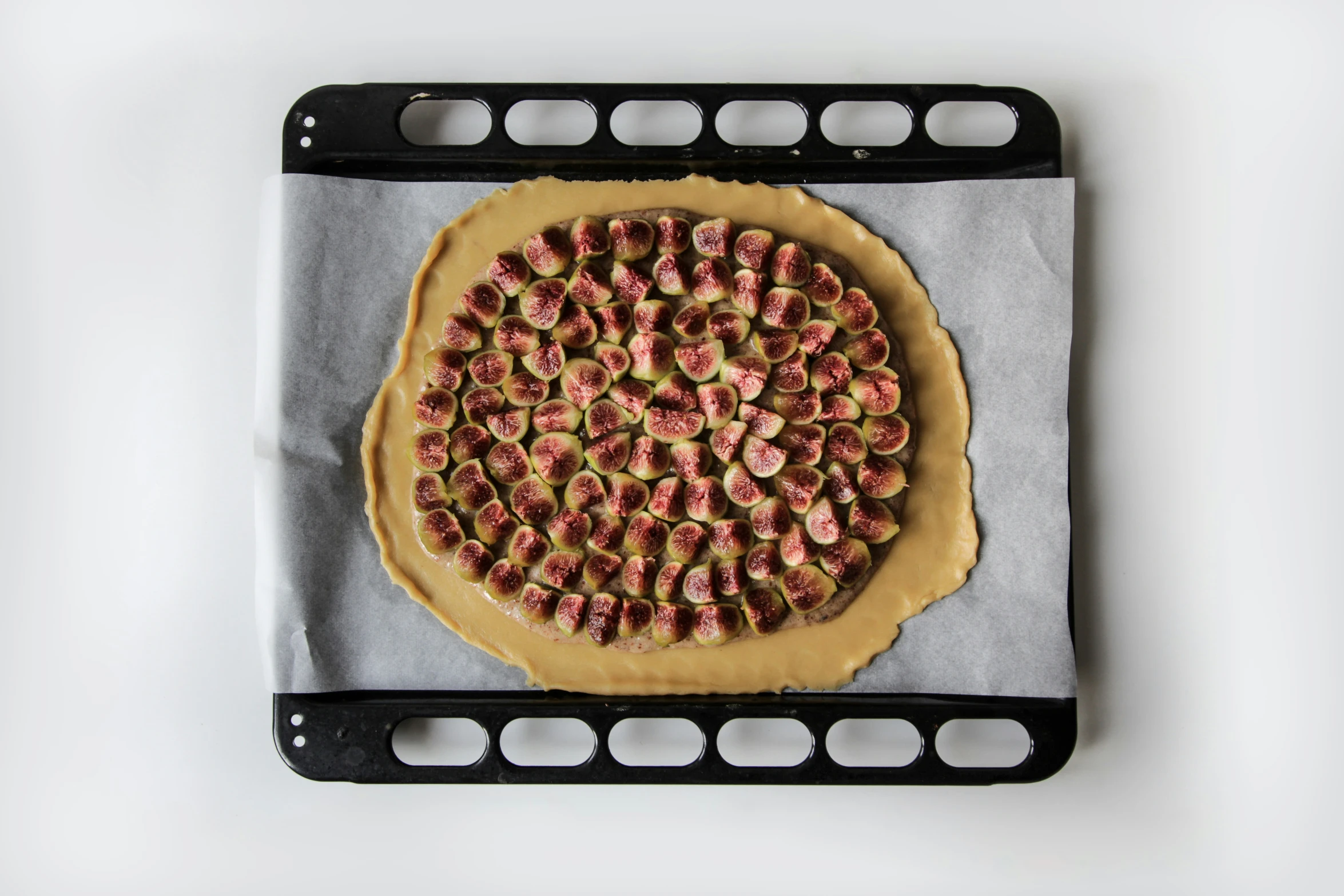 a pizza with many slices on it and a metal tray