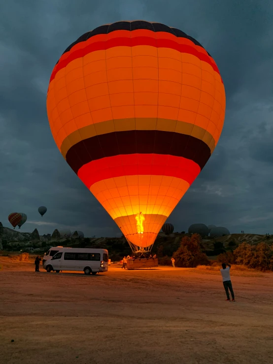 an evening ride with some  air balloons in the sky