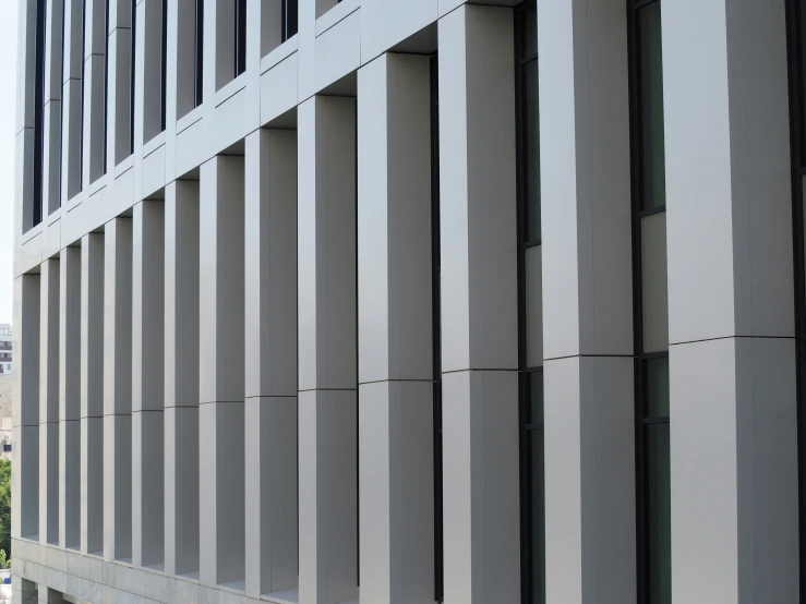 an upward angle of a building with vertical bars on the side