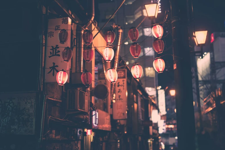 red lanterns and street signs in a city