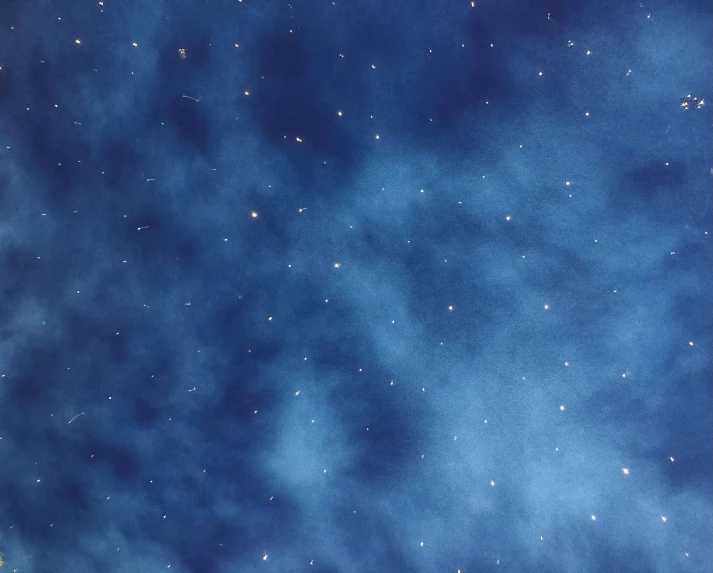 blue and white clouds against the night sky