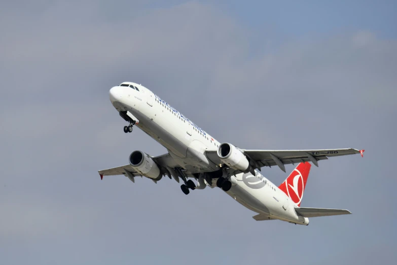 a airplane flying overhead in the sky