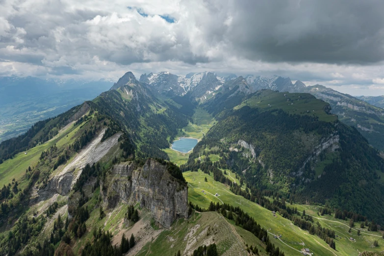 a group of mountains with clouds in the sky