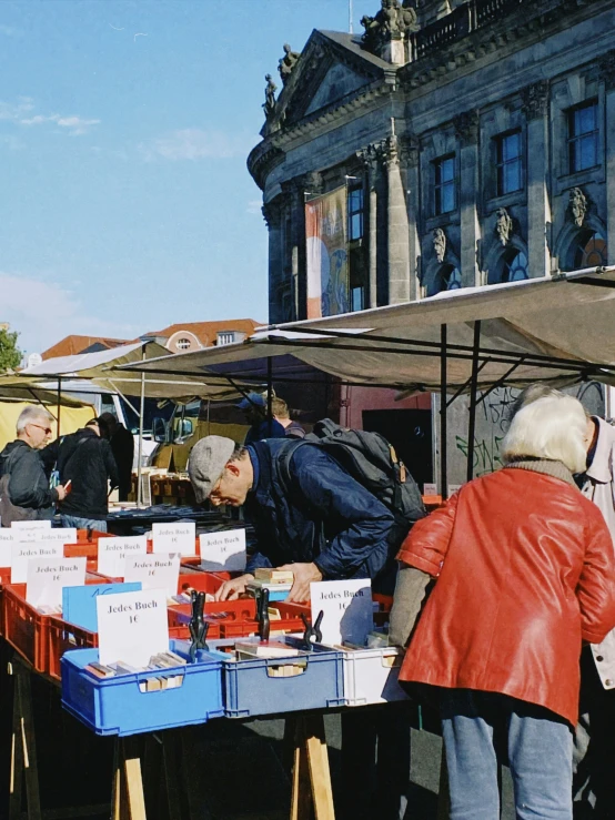 a blue table filled with boxes covered in white boxes