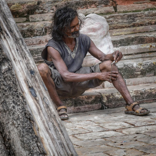 a man sitting on some steps next to steps