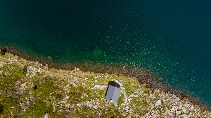 an airplane flying over a large body of water