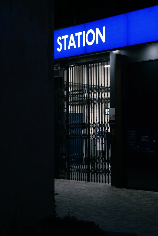 a picture of a station entrance in the dark