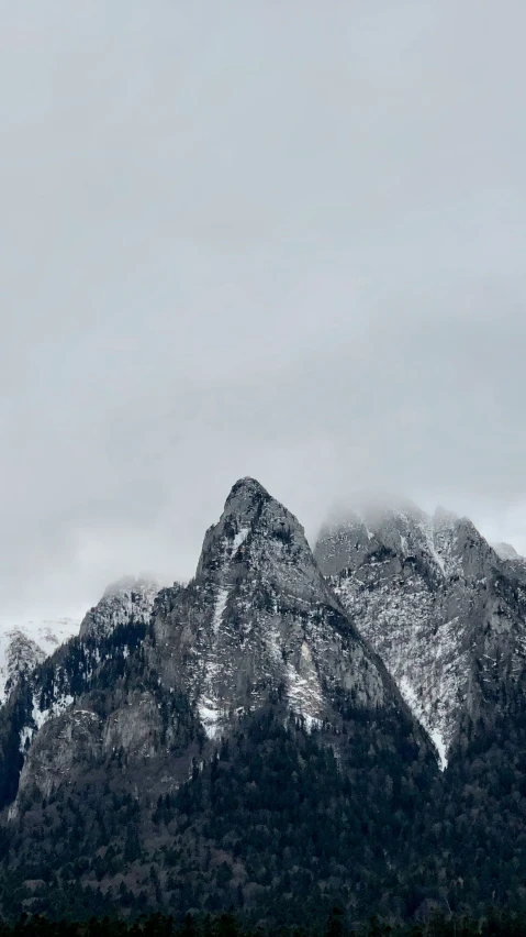 some snow mountains and water and the sky