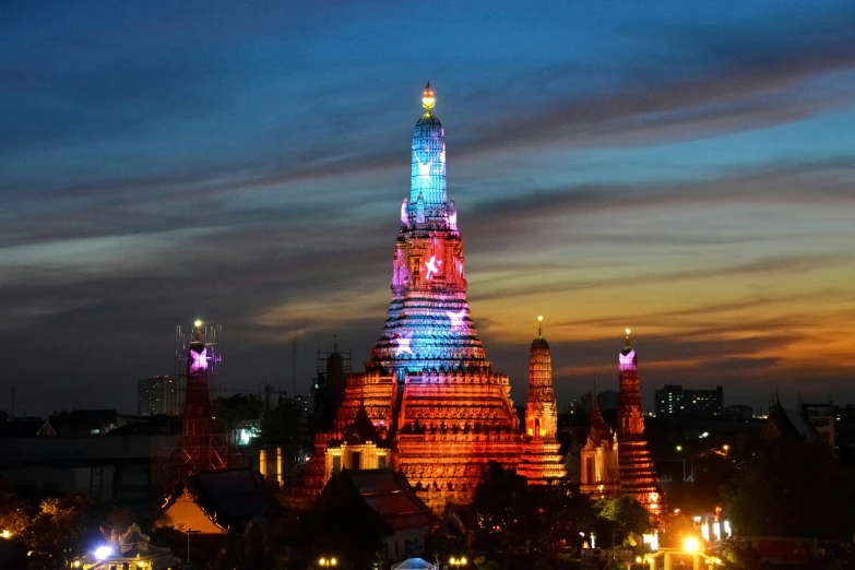 the skyline is lit up and lit up with colorful lights