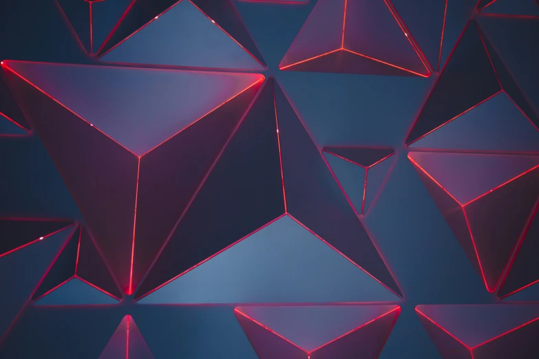 a background with triangular shapes that are purple