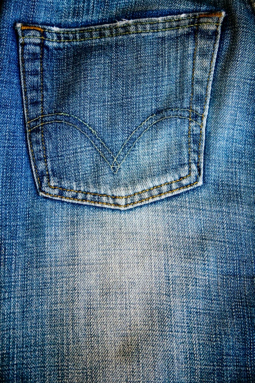 the front pocket of a pair of jeans with ons on each side